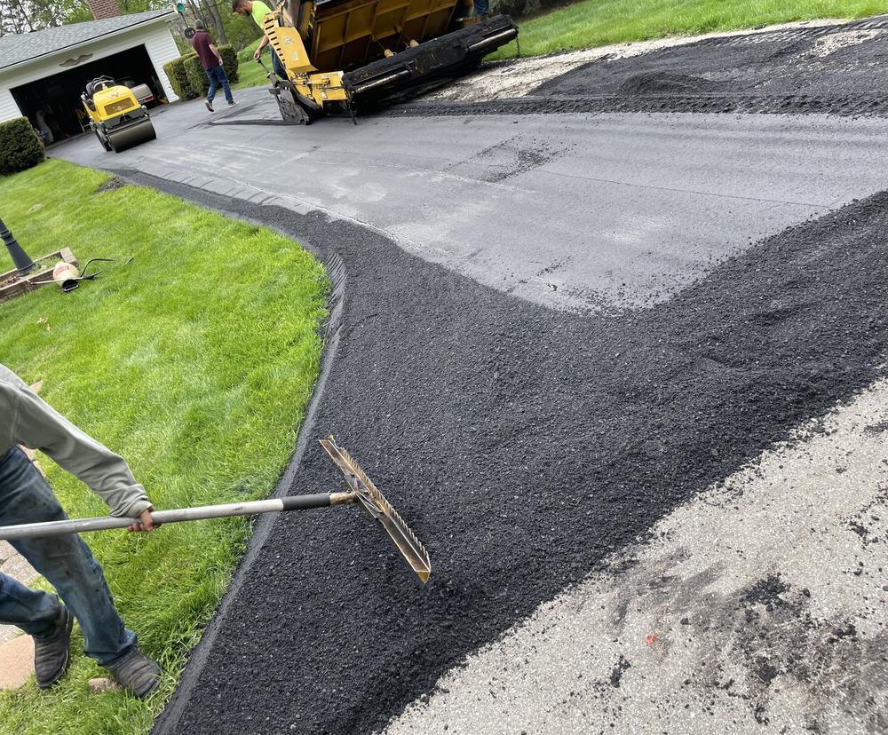 Original Asphalt repair crew fixing asphalt in Florida