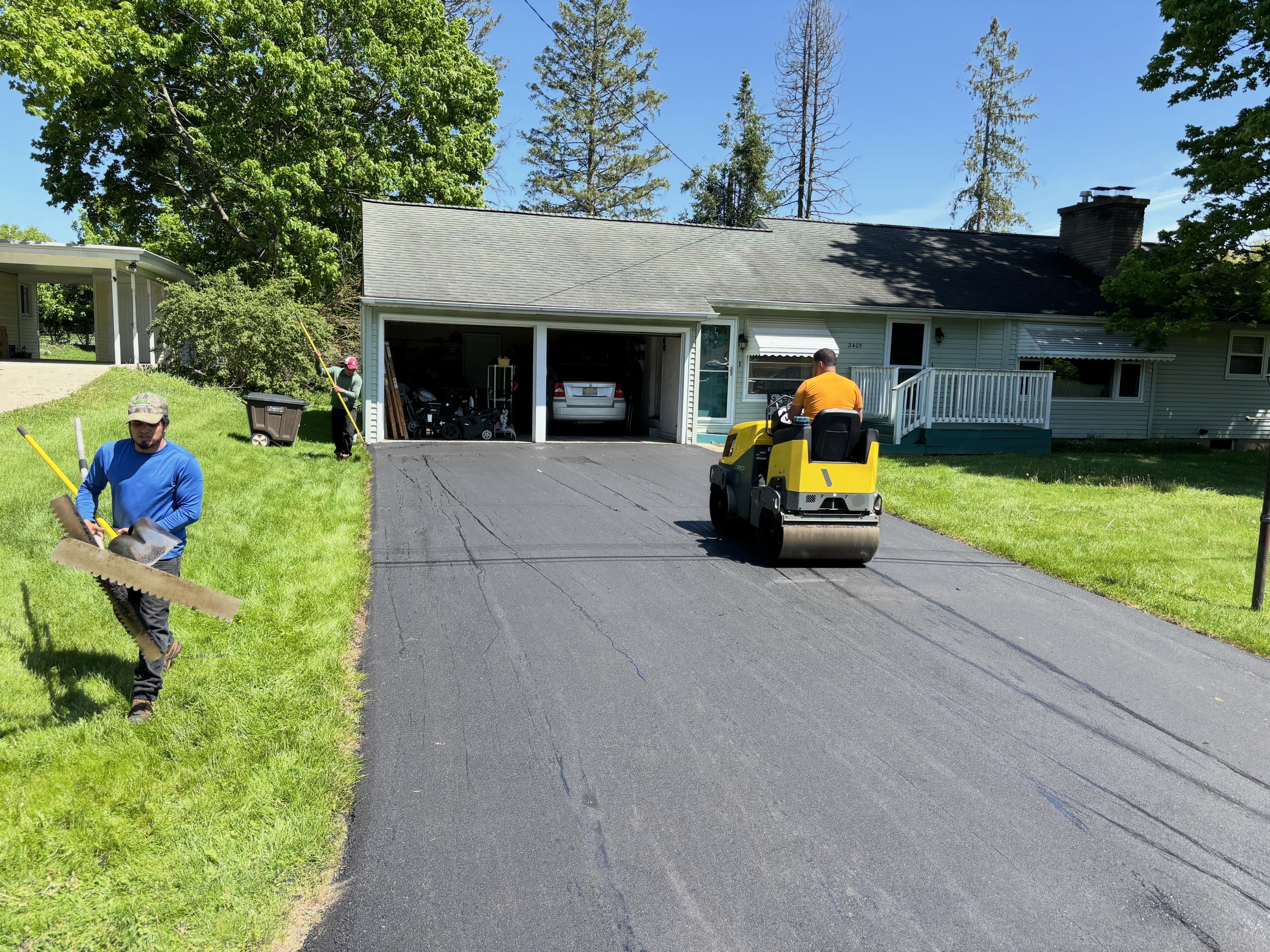 Original Asphalt crew paving residential driveway in Florida